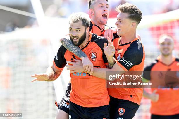 Charles Austin of the Roar is congratulated by team mates after scoring a goal during the round five A-League Men's match between Brisbane Roar and...