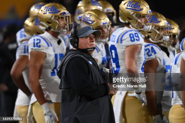 Head coach Chip Kelly of the UCLA Bruins looks up at the scoreboard during a stop in play against the Arizona State Sun Devils during the second...