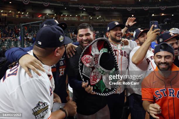 Jose Urquidy of the Houston Astros celebrates with friends and family after defeating the Philadelphia Phillies 4-1 to win the 2022 World Series in...
