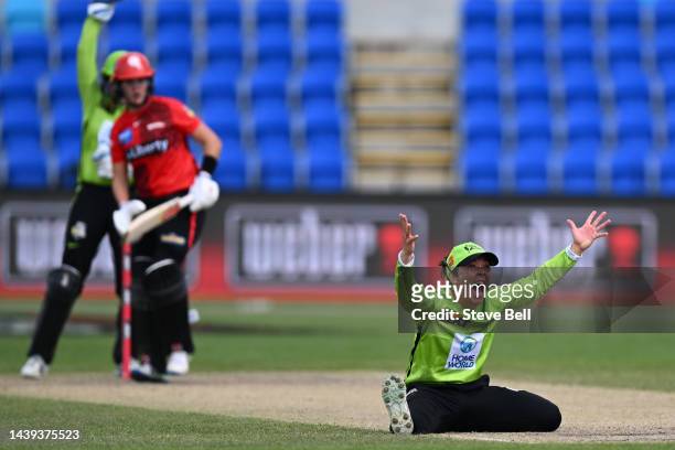 Lauren Smith of the Thunder appeals for the wicket of Josie Dooley of the Renegades during the Women's Big Bash League match between the Melbourne...
