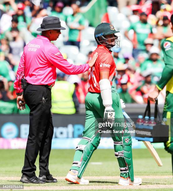 Shakib Al Hasan of Bangladesh is instructed by the umpire to leave the oval after being found out LBW for a duck bowled by Shadab Khan of Pakistan...