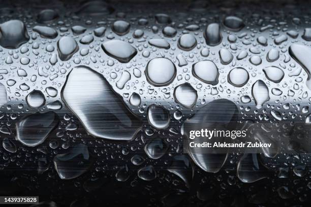 cloudy days, raindrops on metal handrails or iron railings. rainy weather, rain background and bokeh. beautiful water drops on iron parts. - georgia steel fotografías e imágenes de stock