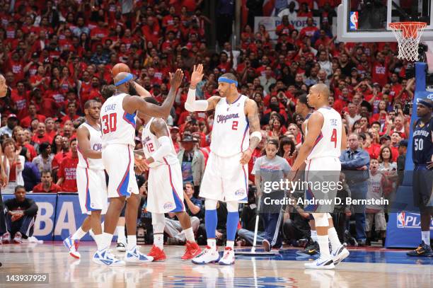 Reggie Evans and Kenyon Martin of the Los Angeles Clippers slap hands during their game against the Memphis Grizzlies in Game Three of the Western...