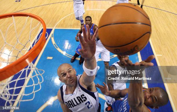 Russell Westbrook of the Oklahoma City Thunder takes a shot against Jason Kidd of the Dallas Mavericks during Game Four of the Western Conference...