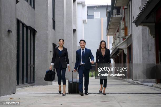 businessperson are working and travel outside office. - business man walking with a bag in asia bildbanksfoton och bilder