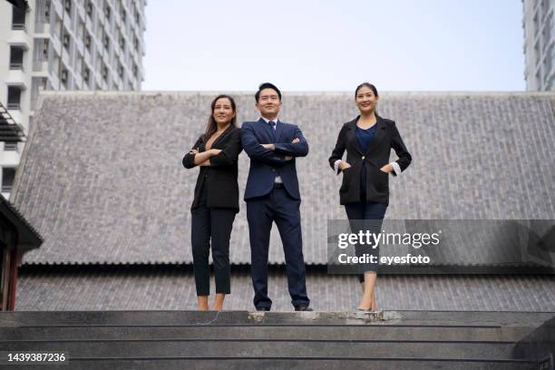 businessperson are working and travel outside office. - group of businesspeople standing low angle view stock pictures, royalty-free photos & images