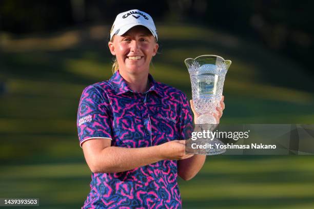 Gemma Dryburgh of Scotland poses with the trophy after winning the tournament following the final round of the TOTO Japan Classic at Seta Golf Course...