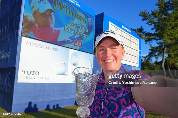 Gemma Dryburgh of Scotland imitates a selfie after winning the tournament following the final round of the TOTO Japan Classic at Seta Golf Course...