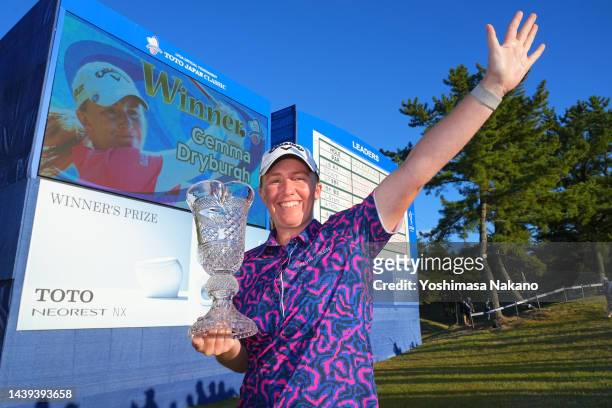 Gemma Dryburgh of Scotland poses with the trophy after winning the tournament following the final round of the TOTO Japan Classic at Seta Golf Course...