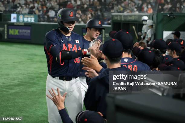 Infielder Munetaka Murakami of Samurai Japan celebrates with his teammates after hitting a two run home run to make it 4-4 in the eighth inning...