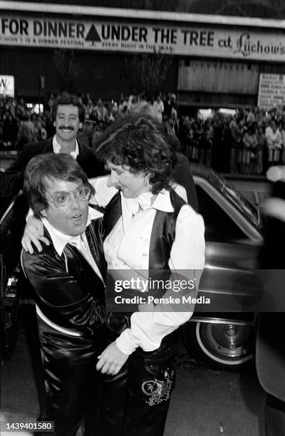 Allan Carr embraces Stockard Channing during a party at Studio 54 in New York City on June 13, 1978.