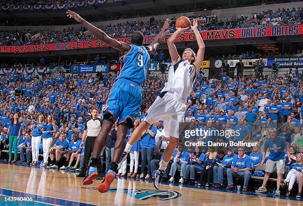 Dirk Nowitzki of the Dallas Mavericks shoots a jumper against Serge Ibaka of the Oklahoma City Thunder in Game Four of the Western Conference...