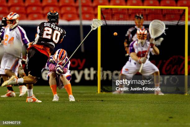 Jeremy Sieverts of the Denver Outlaws scores a two-point goal against goalie Scott Rodgers of the Hamilton Nationals during the first half at Sports...