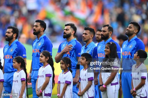 Indian players stand for the national anthem during the ICC Men's T20 World Cup match between India and Zimbabwe at Melbourne Cricket Ground on...