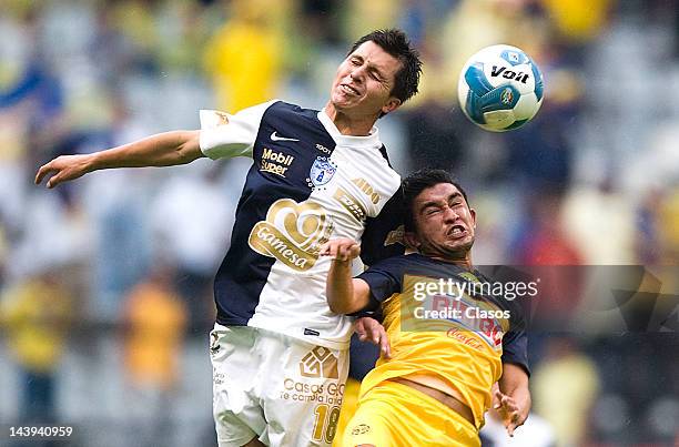 Jose Torres of Pachuca and Christian Bermudez of America fight for the ball during a match between America and Pachuca as part of the Torneo Clausura...