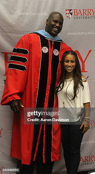 Shaquille O'Neal poses with Nicole "Hoopz" Alexander as he receives his doctoral degree in education from Barry University at James L. Knight Center...