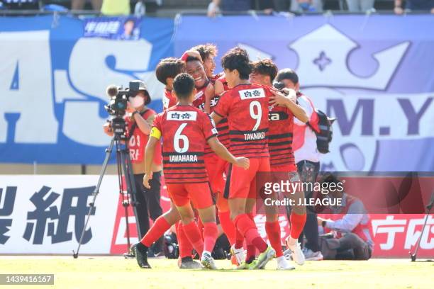 Osamu Henry IYOHA of Roasso Kumamoto celebrates scoring his side's first goal with his team mates during the J.LEAGUE J.LEAGUE J1/J2 Playoff second...