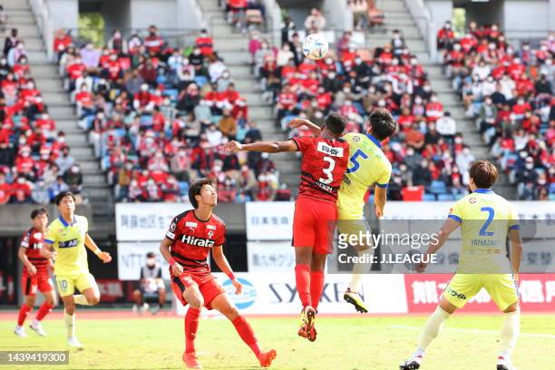 Osamu Henry IYOHA of Roasso Kumamoto and Hiroki NODA of Montedio Yamagata battle for the ball during the J.LEAGUE J.LEAGUE J1/J2 Playoff second round...