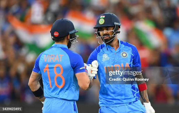 Virat Kohli and KL Rahul of India fist pump in between over during the ICC Men's T20 World Cup match between India and Zimbabwe at Melbourne Cricket...