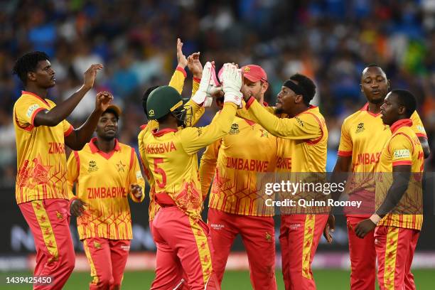 Zimbabwe players celebrate getting the wicket of KL Rahul of India bats during the ICC Men's T20 World Cup match between India and Zimbabwe at...