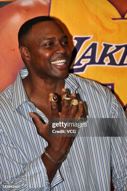 Horace Grant shows his NBA championship rings as he attends DUNK promotional event on May 5, 2012 in Shanghai, China.