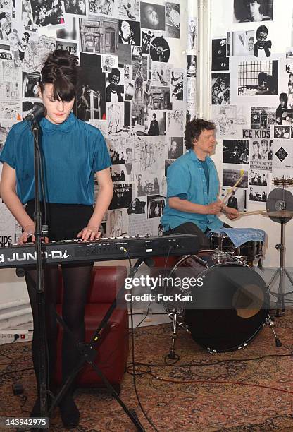Singer A guesta and director/drummer Michel Gondry from the 'Coucou Bonjour' band perform during the Michel Gondry Exhibition Taking Down Party at La...