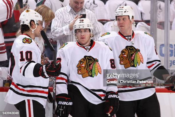 Patrick Sharp, Patrick Kane and Bryan Bickell of the Chicago Blackhawks warm up before Game One of the Western Conference Quarterfinals against the...