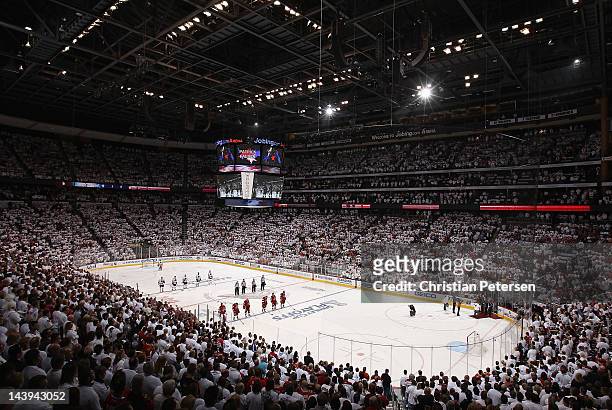 General view as the Chicago Blackhawks and the Phoenix Coyotes stand attended for the National Anthem before Game One of the Western Conference...