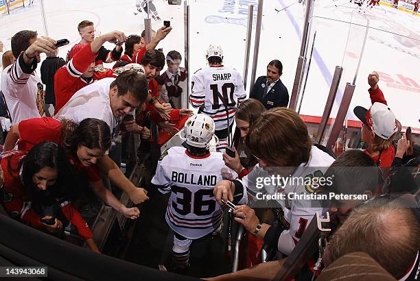 Patrick Sharp and Dave Bolland of the Chicago Blackhawks skate out onto the ice before Game One of the Western Conference Quarterfinals against the...