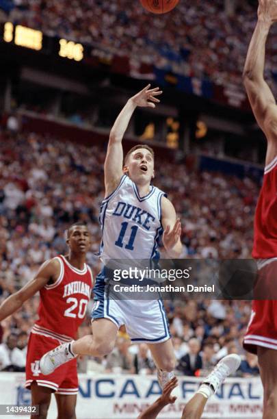 Bobby Hurley of the Duke Hoops goes for a layup during their game against the Indiana Hoosiers at the Hubert H. Humphrey Metrodome in Minneapolis,...