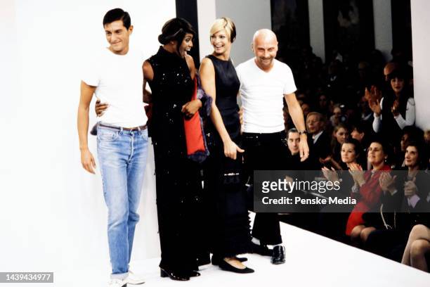 Designers Domenico Dolce and Stefano Gabbana walk the runway at show finale with models Naomi Campbell and Linda Evangelista.