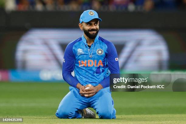 Virat Kohli of India takes a catch to dismiss Wesley Madhevere of Zimbabwe for a duck during the ICC Men's T20 World Cup match between India and...