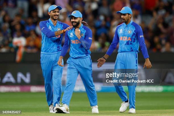 Virat Kohli of India celebrates taking a catch to dismiss Wesley Madhevere of Zimbabwe for a duck during the ICC Men's T20 World Cup match between...