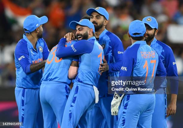 Virat Kohli congratulates Hardik Pandya of India for getting the wicket of Craig Ervine of Zimbabwe during the ICC Men's T20 World Cup match between...