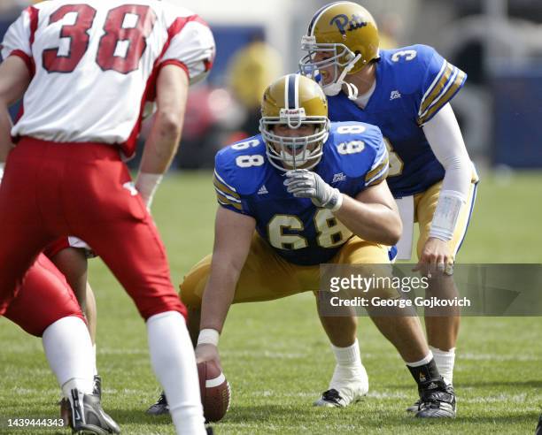 Center Joe Villani and quarterback Tyler Palko of the University of Pittsburgh Panthers look on from the line of scrimmage during a college football...