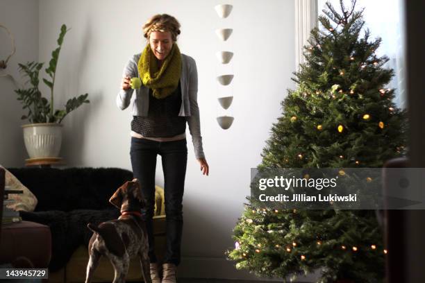 woman and christmas tree - jillian stock pictures, royalty-free photos & images