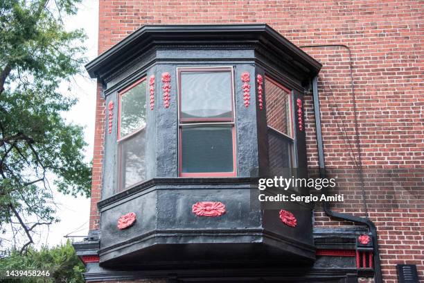 ornate victorian bay window on red brick building - bay window stock pictures, royalty-free photos & images