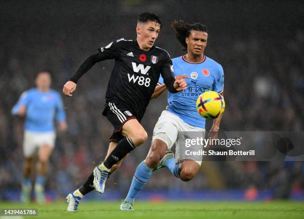 Harry Wilson of Fulham breaks away from Nathan Ake of Manchester City during the Premier League match between Manchester City and Fulham FC at Etihad...