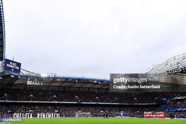 Players, fans and officials observe a silence for Armistice Day prior to the Premier League match between Chelsea FC and Arsenal FC at Stamford...
