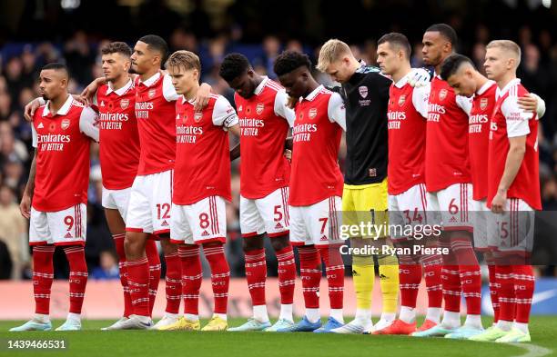 Arsenal players observe a silence for Armistice Day prior to the Premier League match between Chelsea FC and Arsenal FC at Stamford Bridge on...