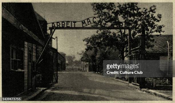 Auschwitz I concentration camp postcard - view of the metal sign reading 'Arbeit Mach Frei' - work makes you free. Caption reads: The Gateway of the...