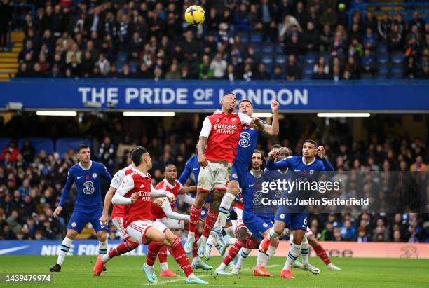 Gabriel Jesus of Arsenal jumps for the ball with Cesar Azpilicueta of Chelsea during the Premier League match between Chelsea FC and Arsenal FC at...