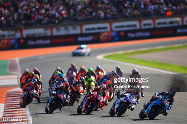 Jack Miller of Australia and Ducati Lenovo Team Alex Rins of Spain and Team SUZUKI ECSTAR Jorge Martin of Spain and Pramac Racing, at MotoGP start...