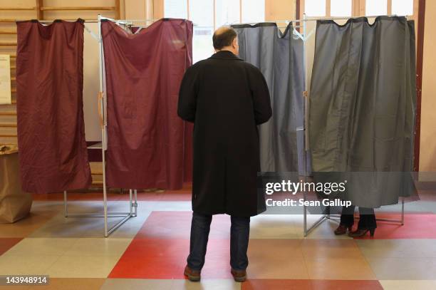 People cast their ballots at a polling station in the second and final round of French presidential elections in the Marais district on May 6, 2012...