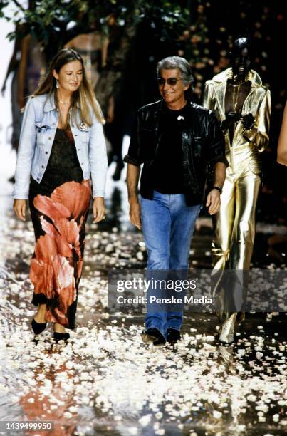 Designer Roberto Cavalli walks the runway at show finale with wife Eva Cavalli and model Alek Wek.