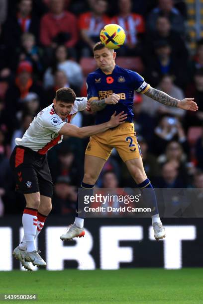 Kieran Trippier of Newcastle United jumps for the ball with Romain Perraud of Southampton during the Premier League match between Southampton FC and...
