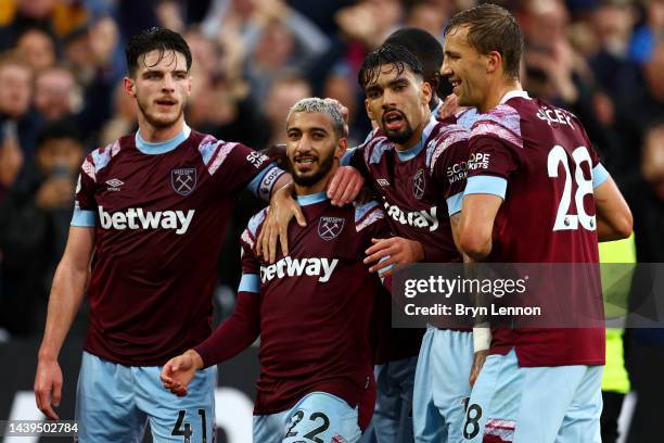 Said Benrahma of West Ham United celebrates with teammates after scoring their team's first goal during the Premier League match between West Ham...