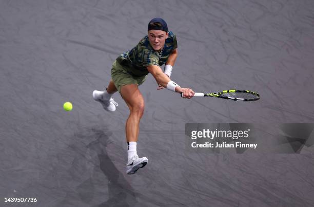Holger Rune or Denmark in action against Novak Djokovic of Serbia in the final during Day Seven of the Rolex Paris Masters tennis at Palais...