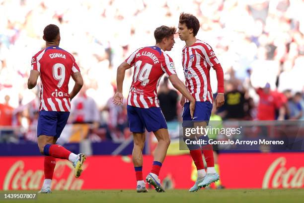 Joao Felix of Atletico de Madrid celebrates with Marcos Llorente after scoring their side's first goal during the LaLiga Santander match between...