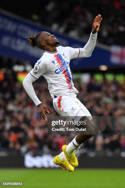 Wilfried Zaha of Crystal Palace celebrates after scoring their team's first goal during the Premier League match between West Ham United and Crystal...